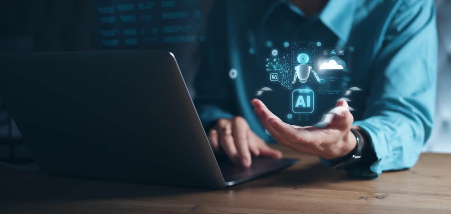 image représentant un homme travaillant sur un ordinateur à l'aide de l'intelligence artificielle
